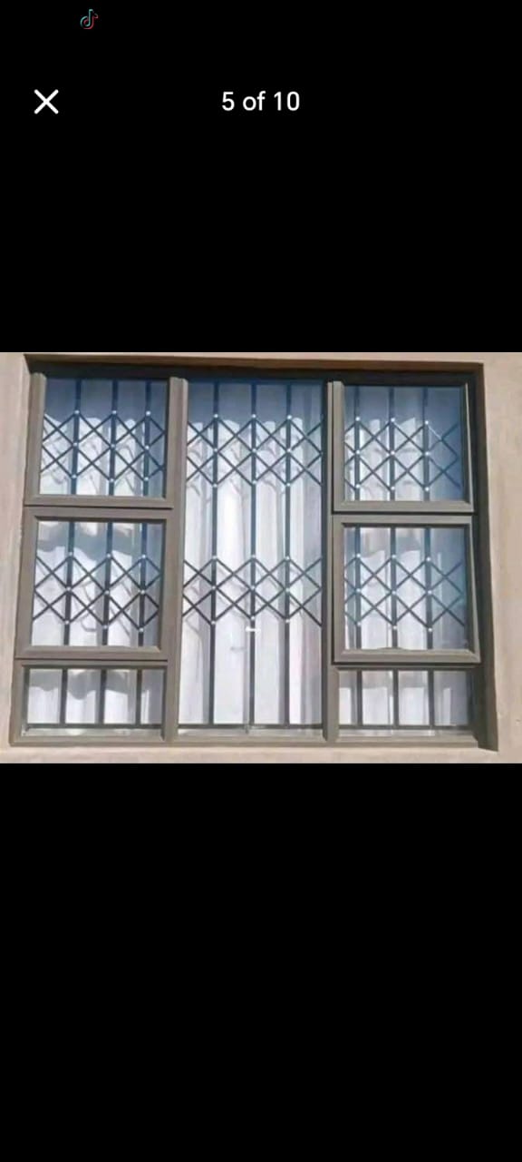 Matte black steel burglar bars with diamond pattern on a Durban home window